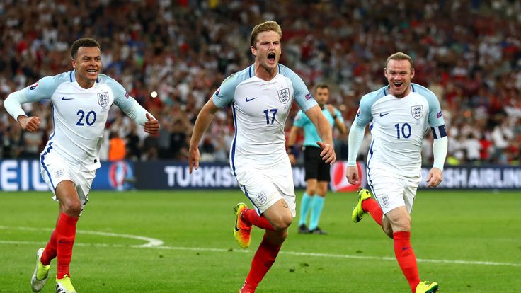 Eric Dier (C) of England celebrates scoring his team's first goal with his team mates during the UEFA EURO 2016 Group B match