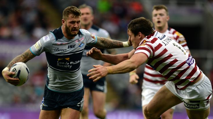 NEWCASTLE UPON TYNE, ENGLAND - MAY 30: Zak Hardaker (L) of Leeds Rhinos tackled by Joel Tomkins of  Wigan Warriors during the Super League match between Le