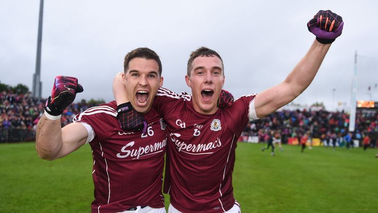 Galway's Sean Denvir, left, and Eamonn Brannigan celebrate following their side's victory in the Connacht GAA Football Semi-Final match between Mayo