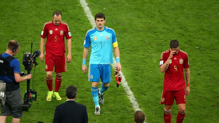 RIO DE JANEIRO, BRAZIL - JUNE 18:  Andres Iniesta, Iker Casillas and Fernando Torres  of Spain look dejected as they walk off the pitch after a 2-0 defeat 