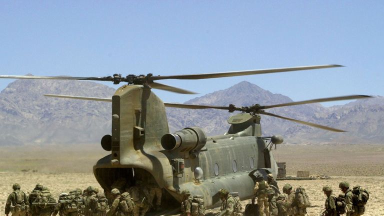 Royal Marines board a Chinook helicopter in Afghanistan