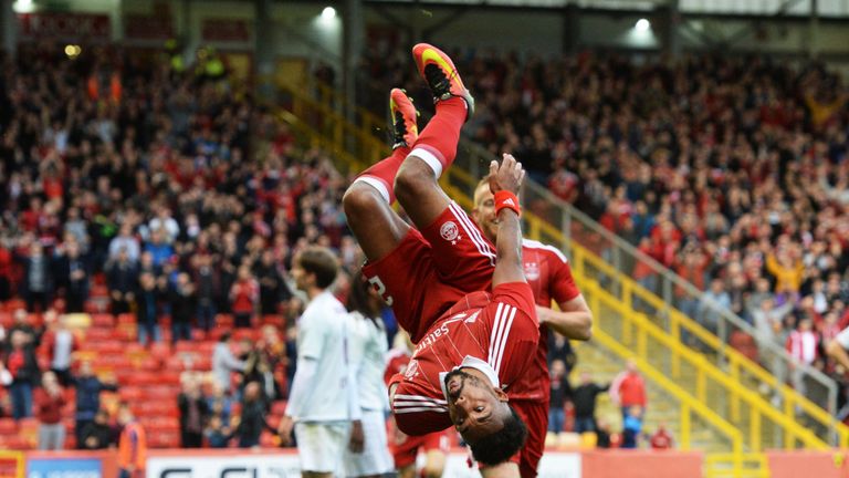 Aberdeen's Shay Logan celebrates after he scores his side's opener