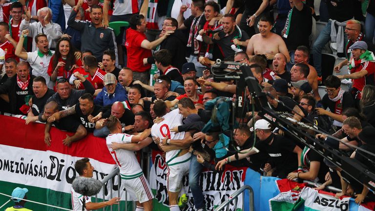 Adam Szalai (C) of Hungary celebrates scoring his team's first goal v Austria with his team-mate Balazs Dzsudzsak and supporters, Euro 2016, Bordeaux