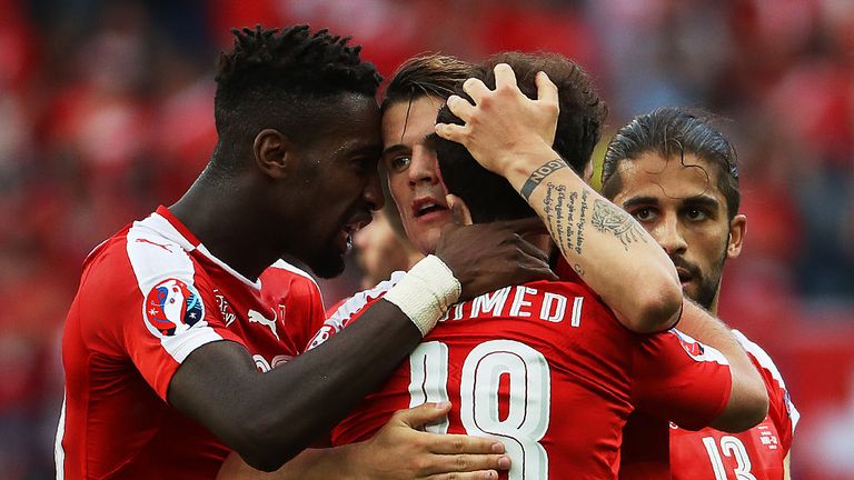 Switzerland's forward Admir Mehmedi (2nd R) celebrates with team mates