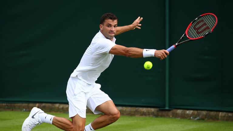 Grigor Dimitrov plays a backhand shot during the Men's Singles first round match against Bjorn Fratangelo