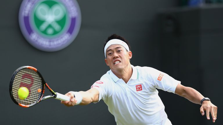 Kei Nishikori plays a forehand shot during the Men's Singles first round match against Sam Groth