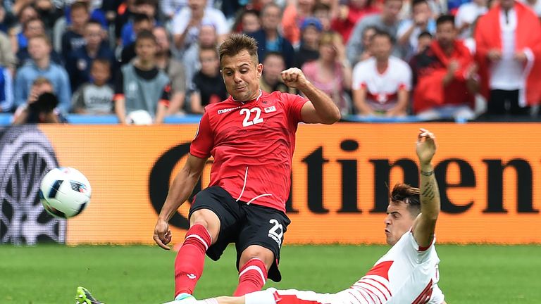 Switzerland's midfielder Granit Xhaka challenges Albania's midfielder Amir Abrashi during the Euro 2016 Group A football match in Lens