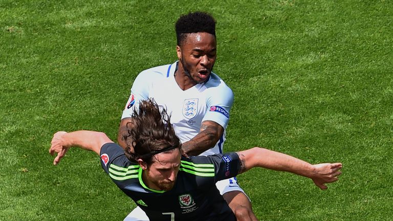 Wales' midfielder Joe Allen (foreground) and England's midfielder Raheem Sterling vie for the ball during the Euro 2016 group B football match between Engl