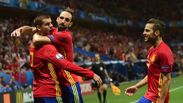 Alvaro Morata (L) celebrates his goal with Juanfran and Cesc Fabregas