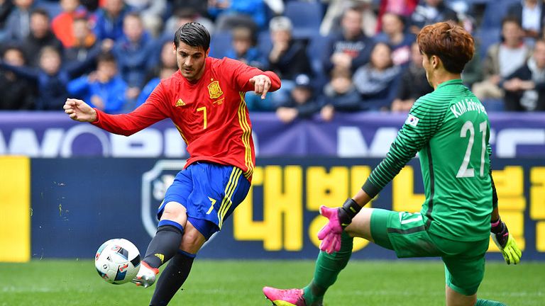 Spain's forward Alvaro Morata and South Korea's goalkeeper Kim Jin-Hyeon vie for the ball