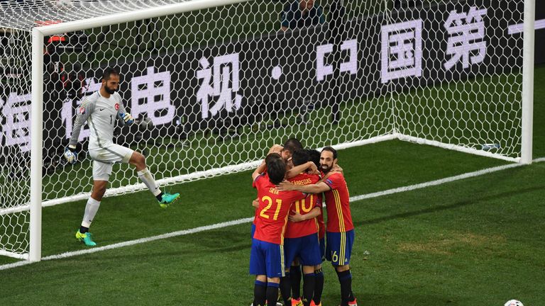 Alvaro Morata celebrates with team-mates after scoring his second goal against Turkey