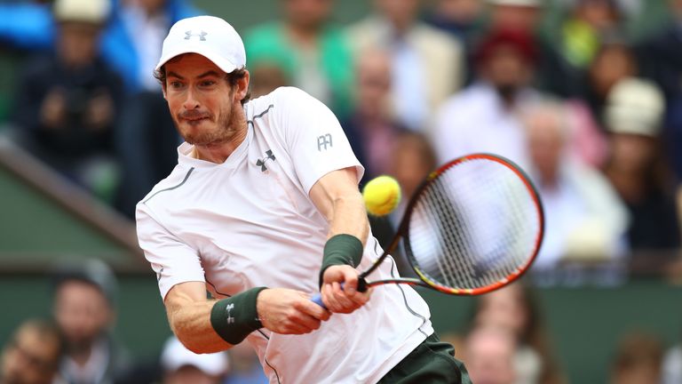 Andy Murray of Great Britain hits a forehand during the Men's Singles final match against Novak Djokovic of Serbia on day fifteen