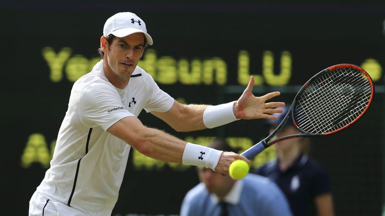 Britain's Andy Murray returns to Taiwan's Lu Yen-hsun during their men's singles second round match on the fourth day of the 2016 Wimbledon Championships a