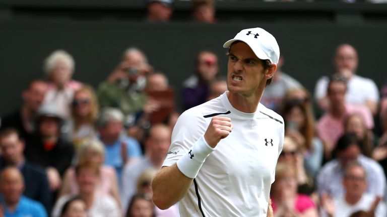 Britain's Andy Murray celebrates after beating Taiwan's Lu Yen-hsun during their men's singles second round match on the fourth day of the 2016 Wimbledon C