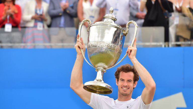 Britain's Andy Murray raises the winners trophy after beating South Africa's Kevin Anderson in the men's singles final match at the ATP Aegon Championships