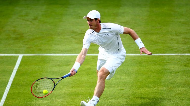 Andy Murray of Great Britain reaches for forehand during his first round match against Nicolas Mahut of France during day two o
