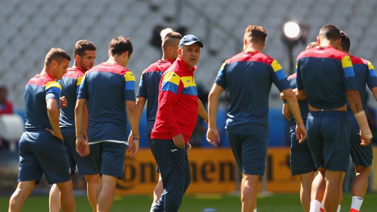 Anghel Iordanescu (C) manager of Romania instructs his players during training session ahead of the UEFA EURO 2016 Group A match v France