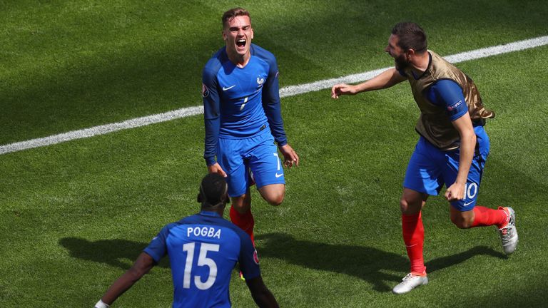 Antoine Griezmann (top) of France celebrates scoring his team's first goal
