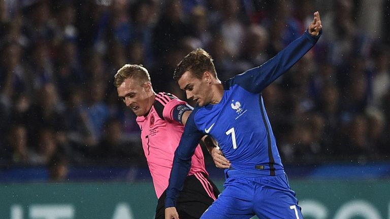 France's forward Antoine Griezmann (R) fights for the ball with Scotland's midfielder Darren Fletcher