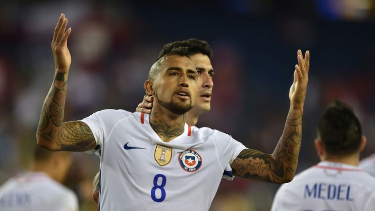 Chile's Arturo Vidal (8) celebrates after scoring against Bolivia 