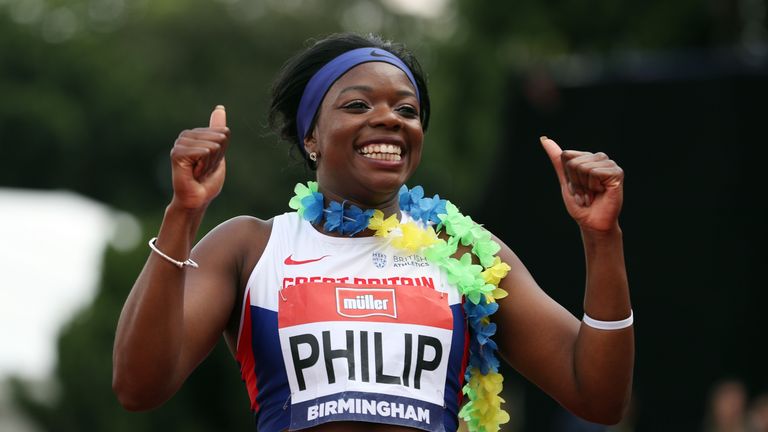 Asha Philip celebrates after winning the 100m during day one of the British Championships at the Alexander Stadium, Birmingham.
