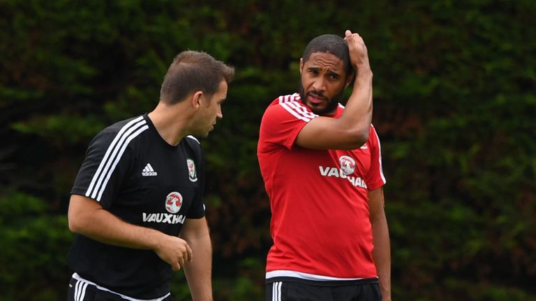 Wales captain Ashley Williams chats with Dr Adam Owen during training at their Euro 2016 base camp in Dinard