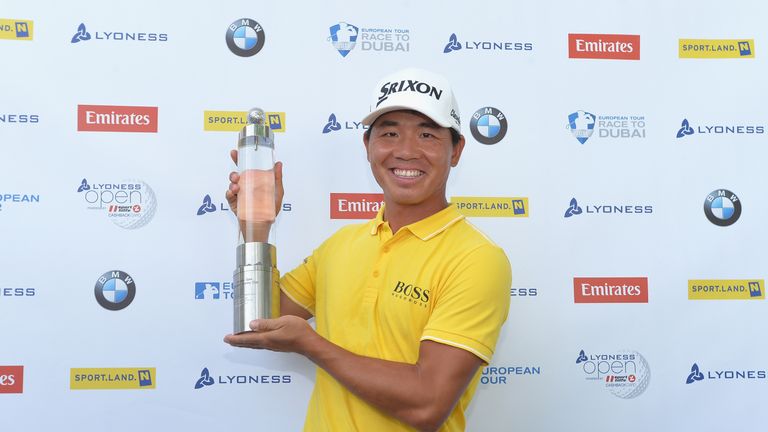 Ashun Wu of China celebrates with the trophy after winning the Lyoness Open during the final round of the Lyoness Open at D