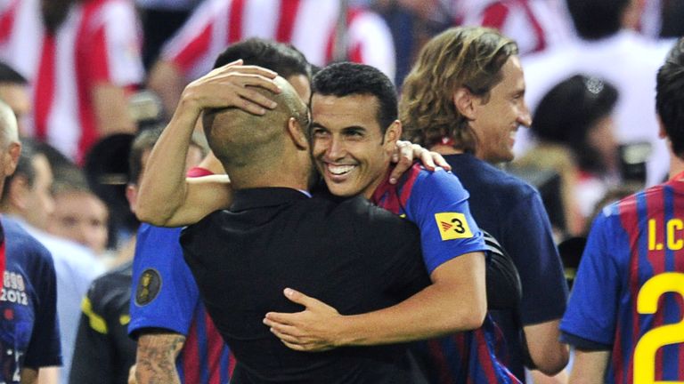 Pep Guardiola hugs Pedro during their days with Barcelona