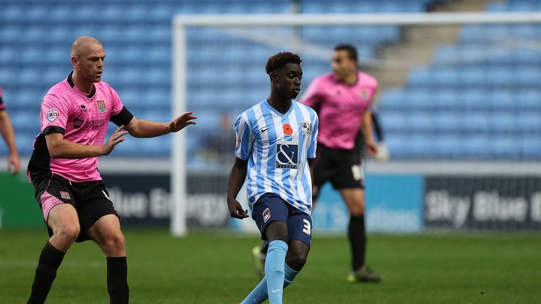 COVENTRY, ENGLAND - NOVEMBER 07:  Bassala Sambou of Coventry City plays the ball watched by Jason Taylor of Northampton Town during The Emirates FA Cup Fir