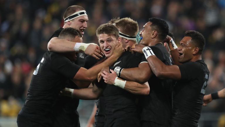 Beauden Barrett (centre) celebrates after scoring for New Zealand against Wales