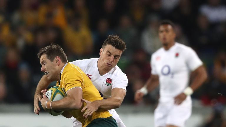 Bernard Foley is tackled by George Ford during the International Test match between Australia and England