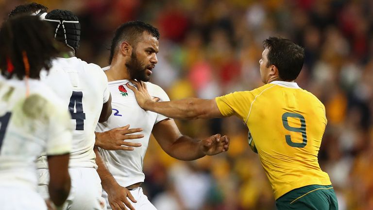 Billy Vunipola  and Nick Phipps  scuffle during the first test in Brisbane