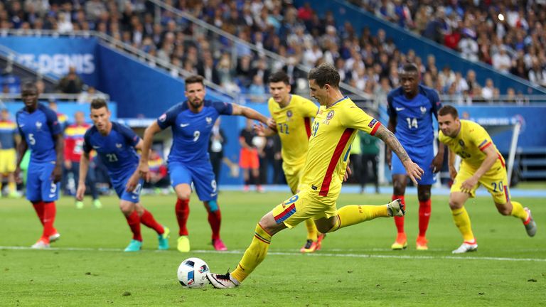 Romania's Bogdan Stancu scores his side's first goal from the penalty spot 