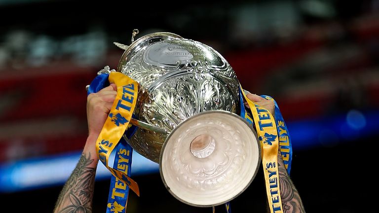 LONDON, ENGLAND - AUGUST 23: Zak Hardaker of Leeds lifts the trophy after his team won the Tetley's Challenge Cup Final between Leeds Rhinos and Castleford