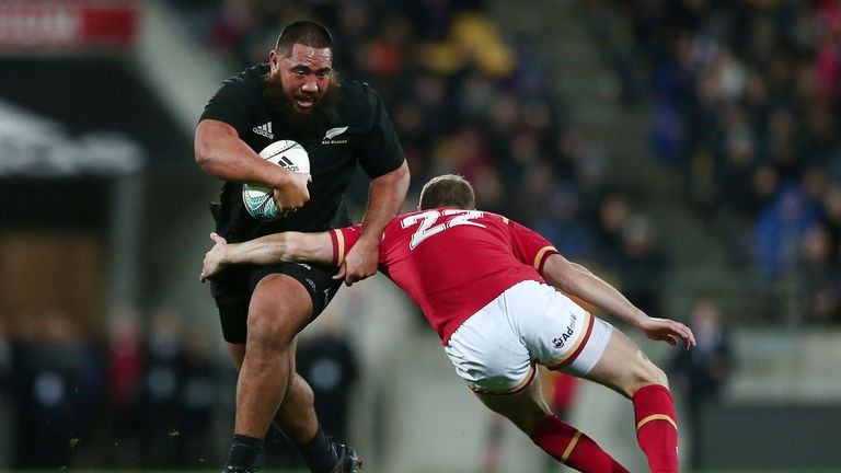 Charlie Faumuina of New Zealand is tackled by Rhys Priestland of Wales during the International Test match between the 