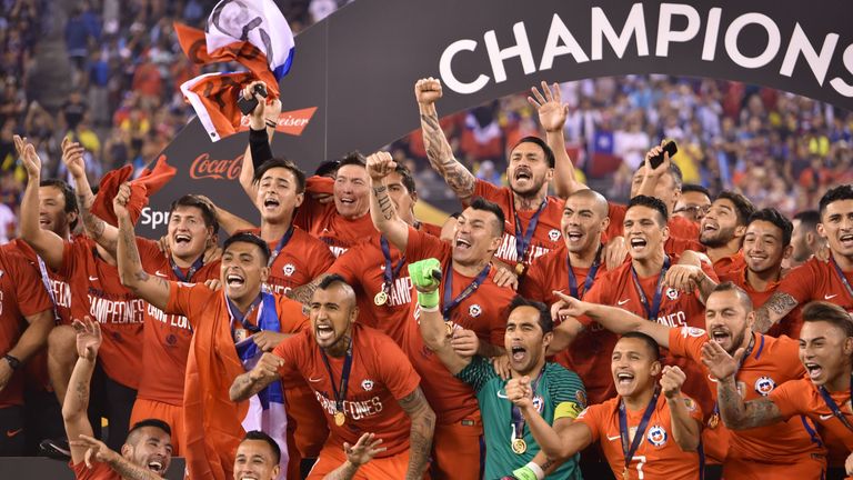 Chile's players pose with the trophy after winning the Copa America Centenario final 