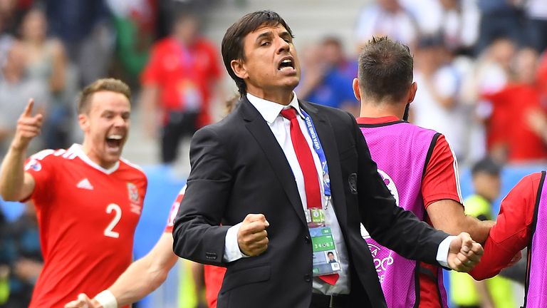 Wales' coach Chris Coleman (R) reacts afters Wales scored the opening goal during the Euro 2016 group B football match between Wales and Slovakia at the St