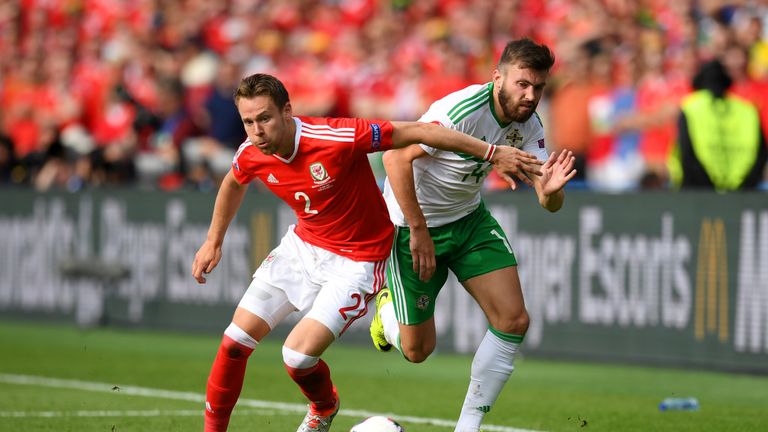PARIS, FRANCE - JUNE 25:  Chris Gunter of Wales and Stuart Dallas of Northern Ireland compete for the ball during the UEFA EURO 2016 round of 16 match betw