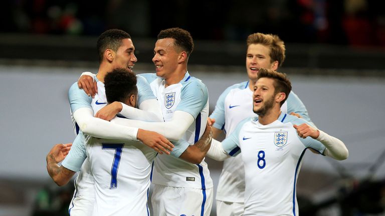 England's Chris Smalling (left) celebrates scoring his side's winning goal