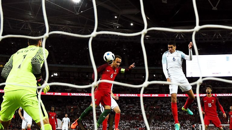 Chris Smalling (6) scores for England against Portugal at Wembley