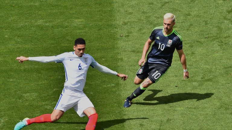 England's defender Chris Smalling (L) and Wales' midfielder Aaron Ramsey vie for the ball during the Euro 2016 group B football match between England and W