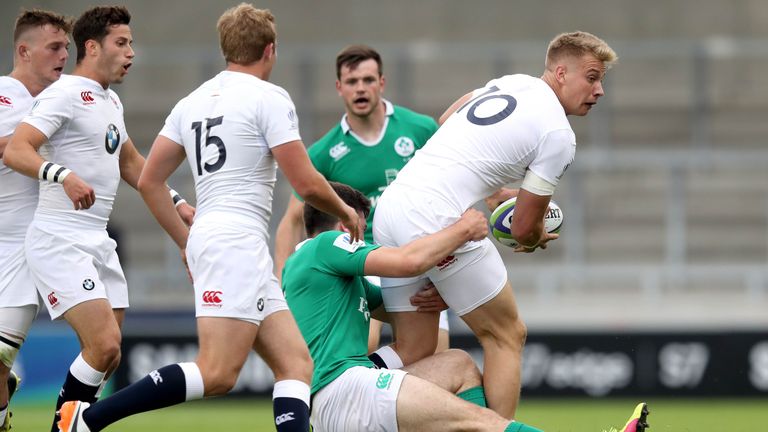 Ireland's Conor O'Brien tackles Harry Mallinder of England.