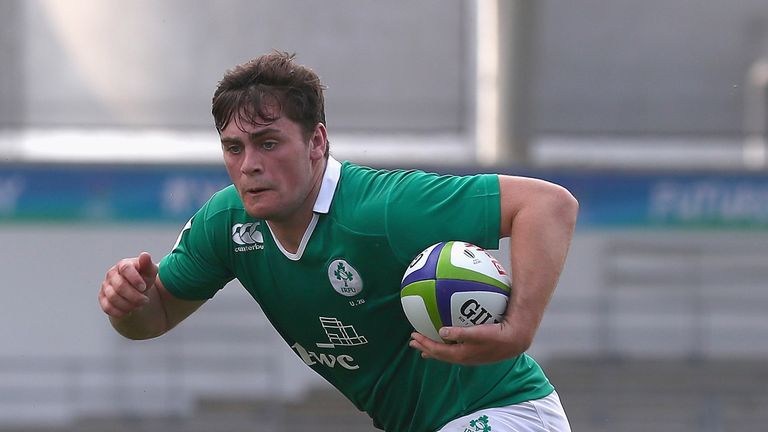  Conor O'Brien of Ireland breaks through the Wales defence