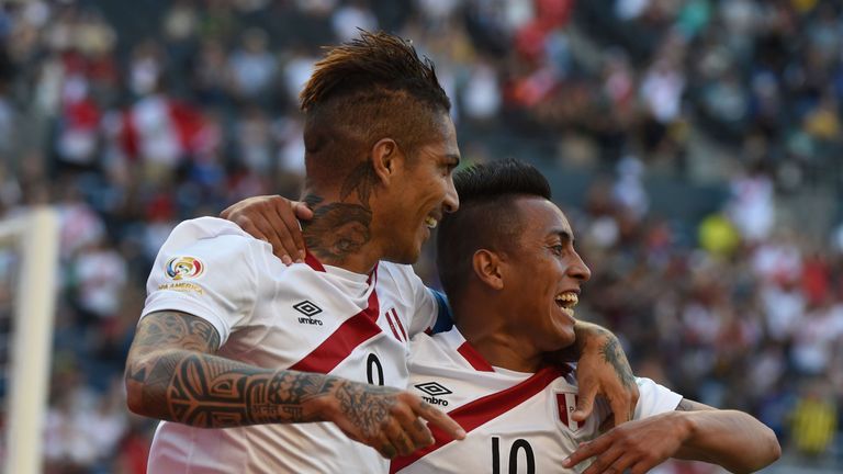 Peru's Paolo Guerrero (L) celebrates with Christian Cueva after scoring against Haiti during the Copa America Centenario football tournament in Seattle, Wa