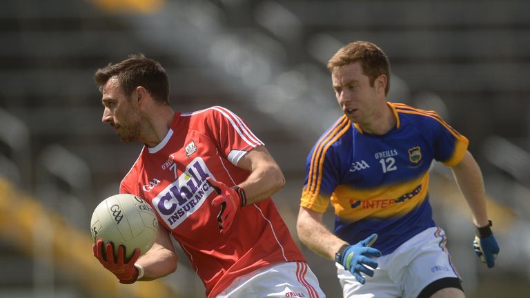 Kevin O'Driscoll of Cork in action against Brian Fox of Tipperary.
