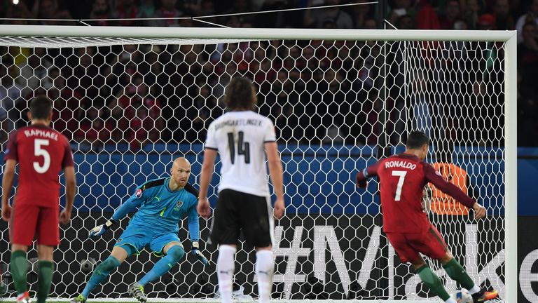 PARIS, FRANCE - JUNE 18: Robert Almer of Austria attempts to save as Cristiano Ronaldo of Portugal hits the post from the penalty spot during the UEFA EURO