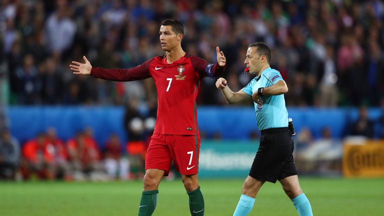 Cristiano Ronaldo of Portugal pleads with referee Cuneyt Cakir 