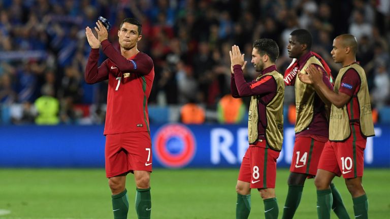 Portugal's forward Cristiano Ronaldo (L) acknowledges the crowd 