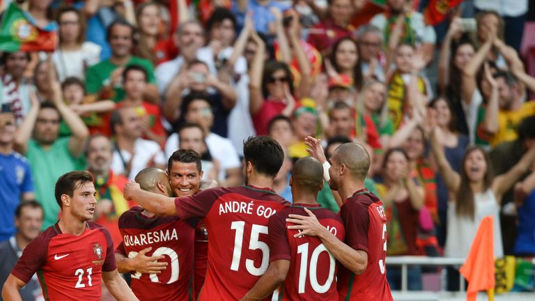 Portugal's forward Cristiano Ronaldo (3L) celebrates with his teammates after scoring against Estonia during the friendly football match Portugal vs Estoni