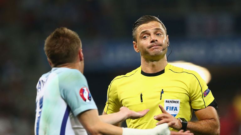 Jamie Vardy of England protests to referee Damir Skomina